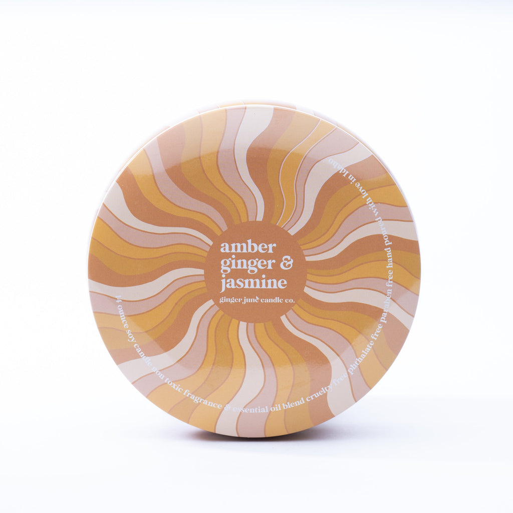 slight dent - groovy swirl tin: amber + ginger + jasmine 14 oz candle