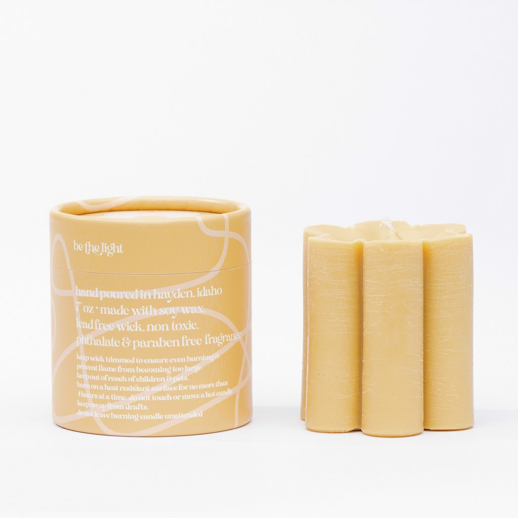 ochre daisy pillar candle  • soy candle